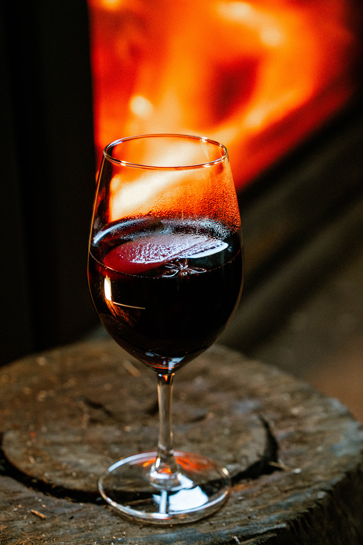 Red wine beside the fireplace at Goat House